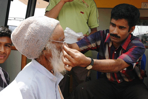 an man being fitted with glasses