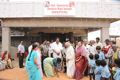 People in front of a new hospital